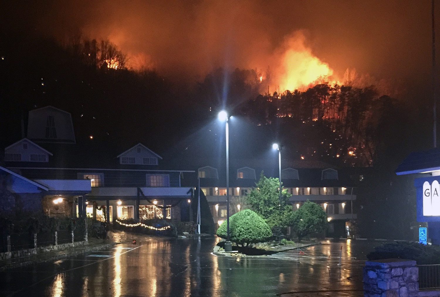 A wildfire burns on a hillside after a mandatory evacuation was ordered in Gatlinburg