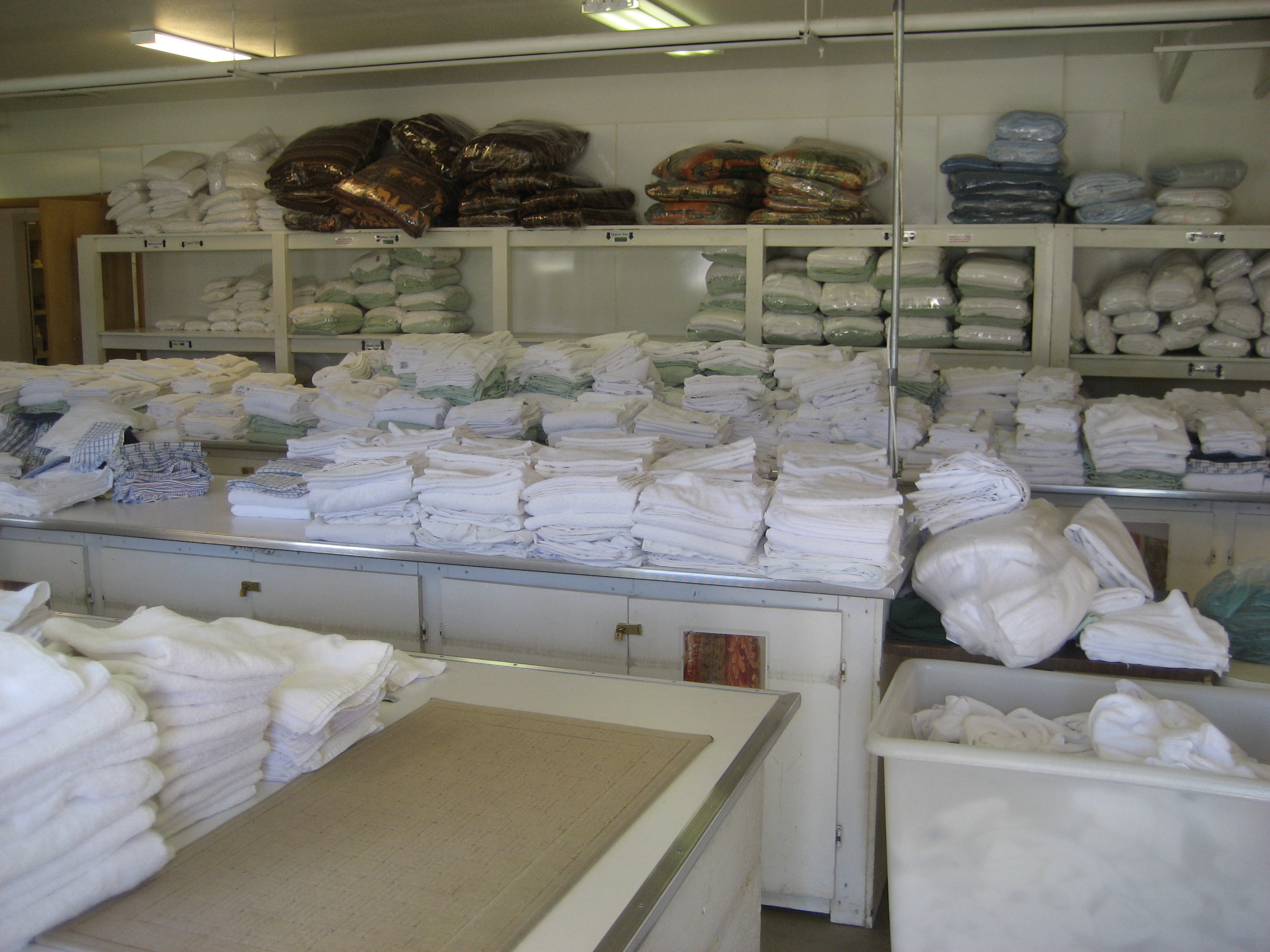 Towels, linens folded and ready to go back into guest rooms